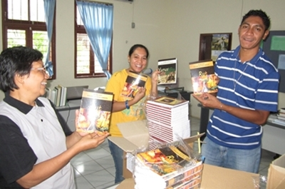 Team members with Scripture portions